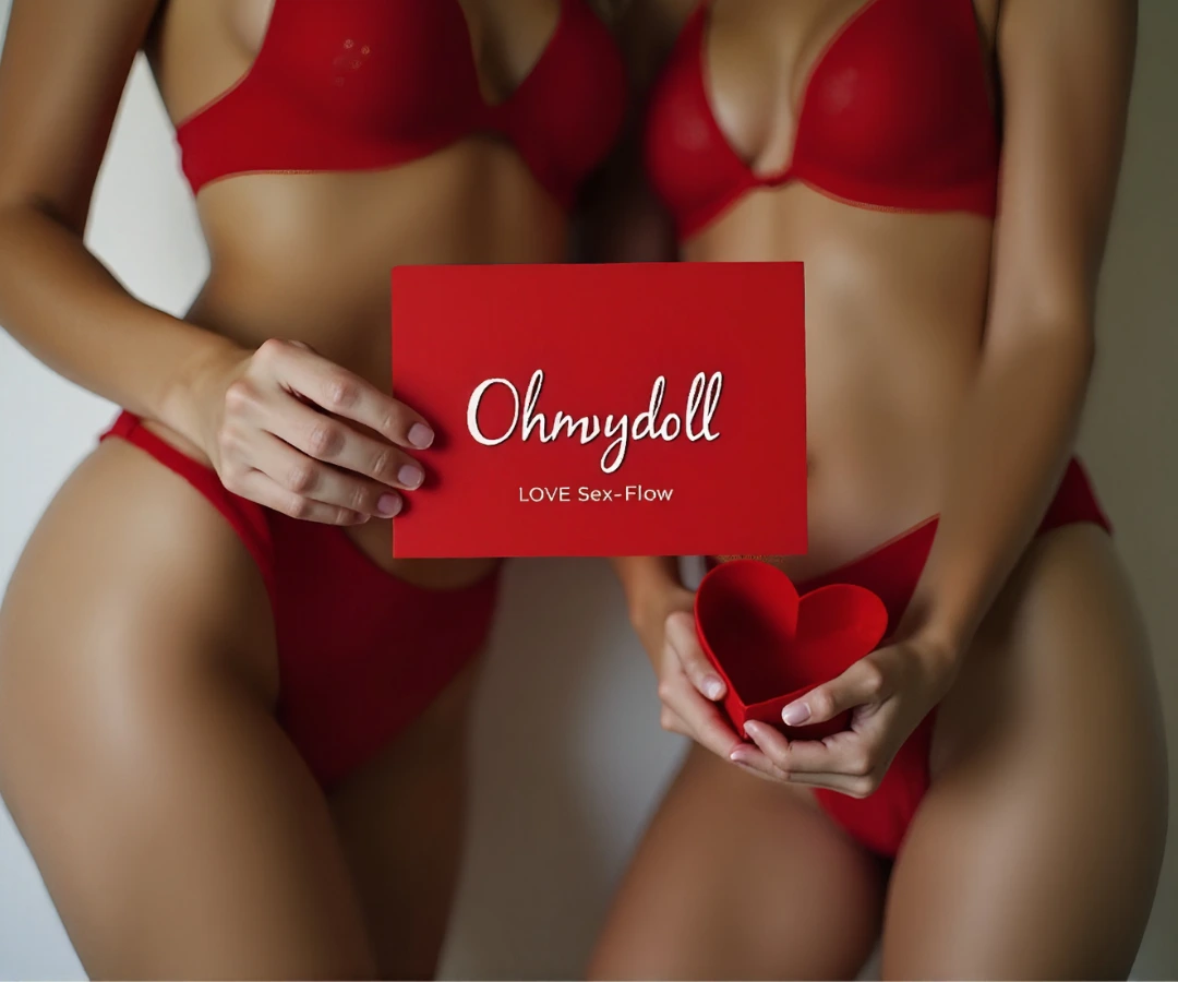 Two women in red lingerie hold a red card that says “Ohmydoll – LOVE Sex-Flow,” with one gently holding a red heart.