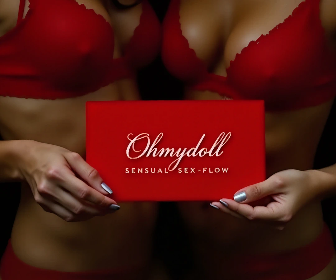 Two women in red lingerie holding a red card labeled “Ohmydoll – Sensual Sex-Flow” with elegant white script.