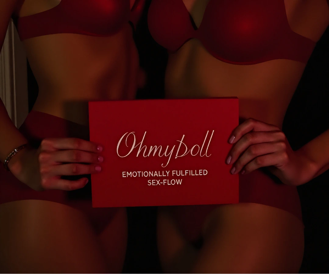 Two women in red lingerie holding a red card that reads "Ohmydoll – Emotionally Fulfilled Sex-Flow" in elegant script.